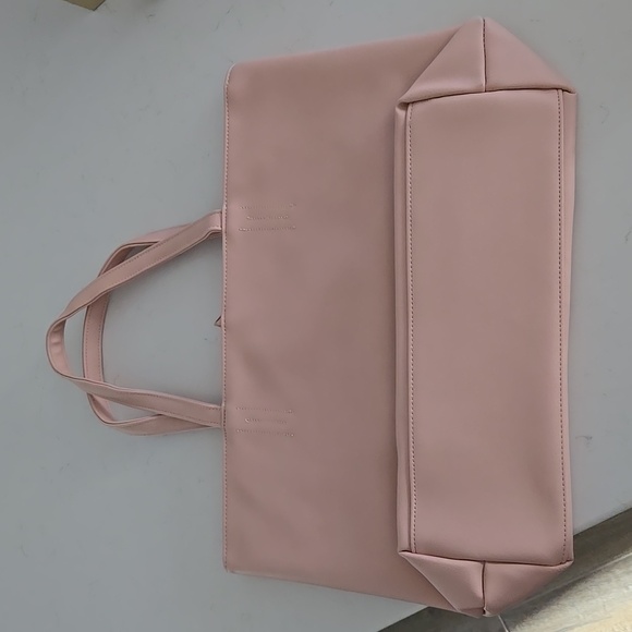 New w/tag never used Light pink tote bag w/ 2 hanging tassles wrapped in plastic - Picture 2 of 6